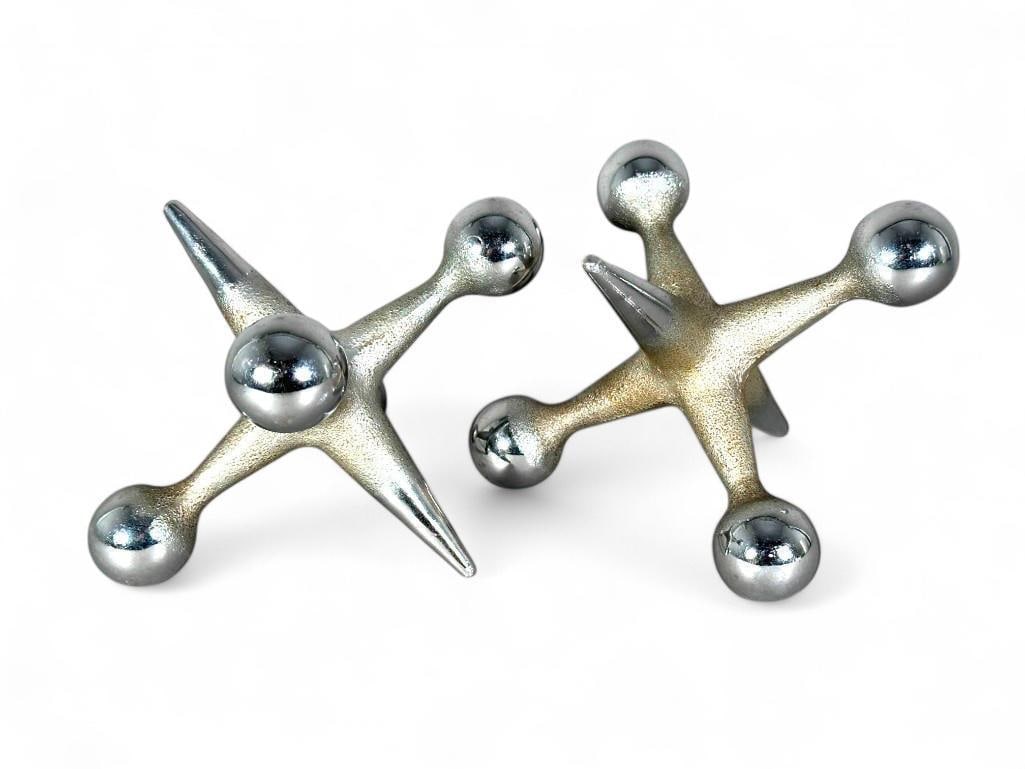 Pair Bill Curry Designed Oversized Jax Jacks Bookends or Doorstops: Pair Bill Curry Design Line (William Edwin Curry American 1927-1931) Oversized Jax Jacks Bookends or Doorstops, in stainless steel with a pebbled and smooth finish. Unmarked. Dimensions: 4.5 x 6 in. C