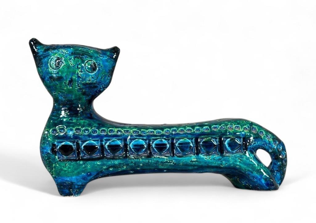 Aldo Londi for Bitossi Raymor, Cat: Aldo Londi for Bitossi Raymor, Cat, elongated form with stamped decorative motifs, glazed in mottled blue green glaze. Stamped Italy with enameled numeral 1975H. Dimensions: 4.75 in.h. x 7.25 in.l. Co