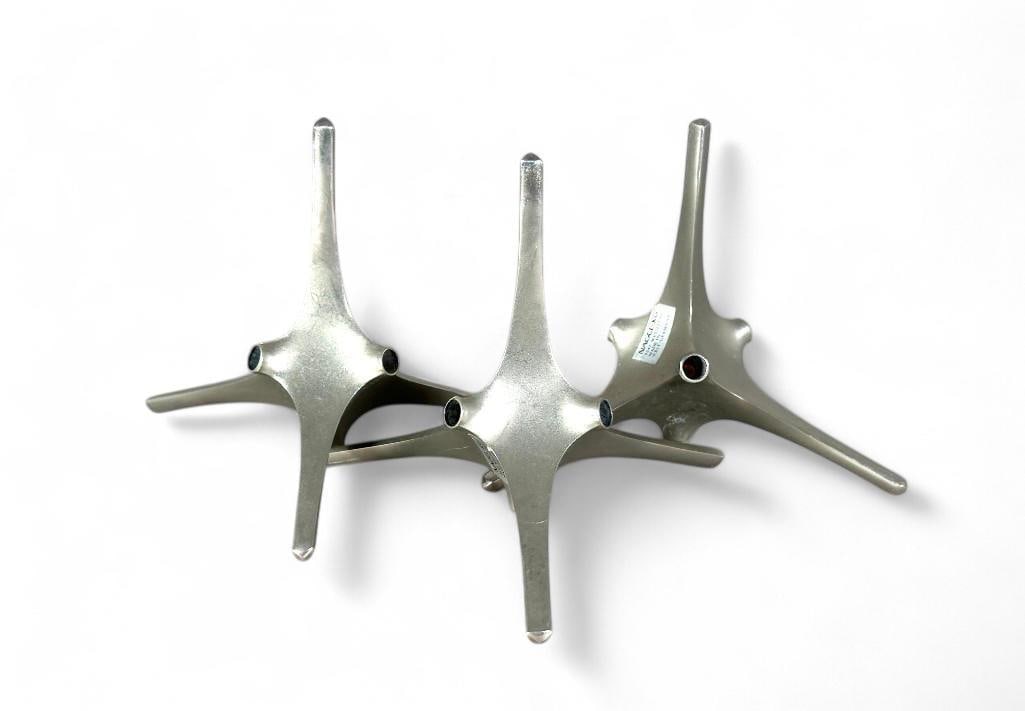 Three Brutalist/Modernist Table Decorations by Fritz Nagel and Caesar Stoffi: Three Brutalist/Modernist Table Decorations by Fritz Nagel and Caesar Stoffi, West Germany, c.1960's, nickel plated tripod forms. bearing original labels. Dimensions: 4.5 in.h. x 5.5 in. Condition: So