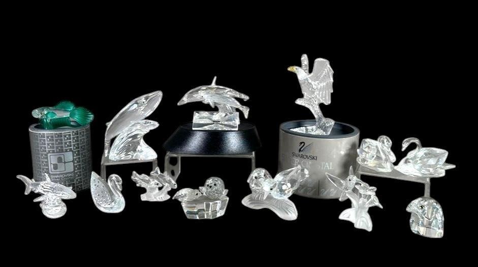Lot of Assorted Swarovski Crystal Figures: Lot of Assorted Swarovski Crystal Figures in original boxes, comprising; Green Beta Fish, Whale Mother and Calf, Dolphin Mother and Calf, Eagle on Perch, Pair of Swans, Single smaller Swan, Swimming S