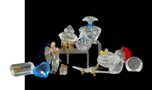 Lot of Assorted Swarovski Crystal Figures: Lot of Assorted Swarovski Crystal Figures, in original boxes, comprising a Display Sign for SCS 2000, Blue Heart Paperweight, Angel Ornament, Warpped Gift, Diamond Perfume on gold Stand, Fish Perfume,
