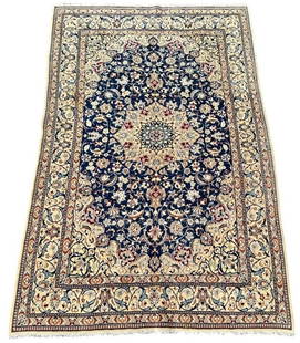Persian Nain Wool and Silk Carpet, ca. 2000-10, 8'2" x 5'4": Like new, Persian wool on cotton foundation, with silk in accent areas highlighting the design. Dark blue oval medallion within a cream color framework with meandering vines with leaves and flowers in