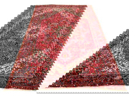 Antique Persian Karajeh-Heriz, ca. 1940, 13'5" x 10'2": Wool on cotton weft Karajeh carpet in Heriz design. primary colors in red and cream; diamond shaped lozenge in center with cream color starburst, expanding into dark blue with medallions and palm exte