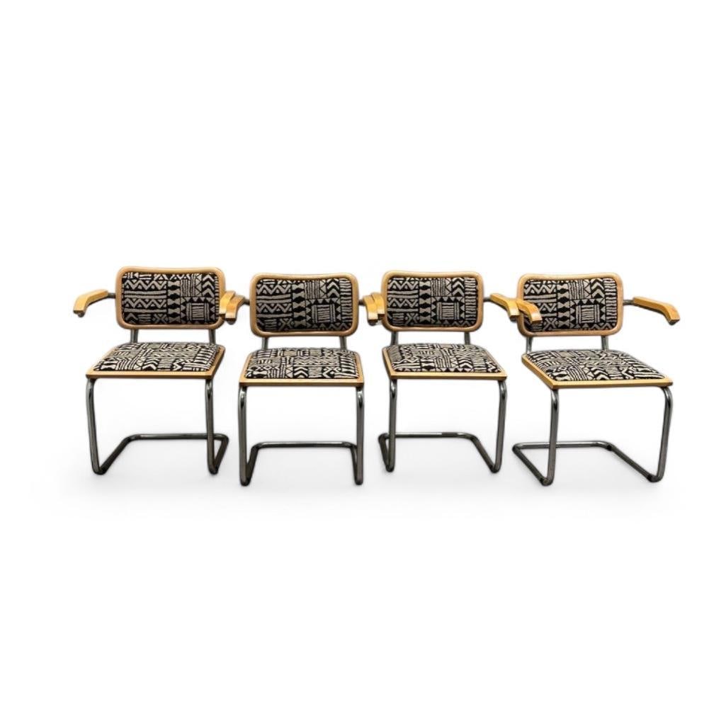 Four Marcel Breuer Designed Cesca Upholstered Armchairs: Four Marcel Breuer Designed Cesca Upholstered Armchairs, designed in 1928, in natural beech wood and tubular chromed steel, cantilevered design with padded seat and back, upholstered in a woven cotton