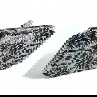 Judith Leiber Swarovski Crystal Minaudiere, Deco Style: Black and silver Swarovski crystal in a Deco Inspired design, with silver metal frame. Interior with silver coin purse, mirror and removable silver chain strap. The pressure clasp is partially is set