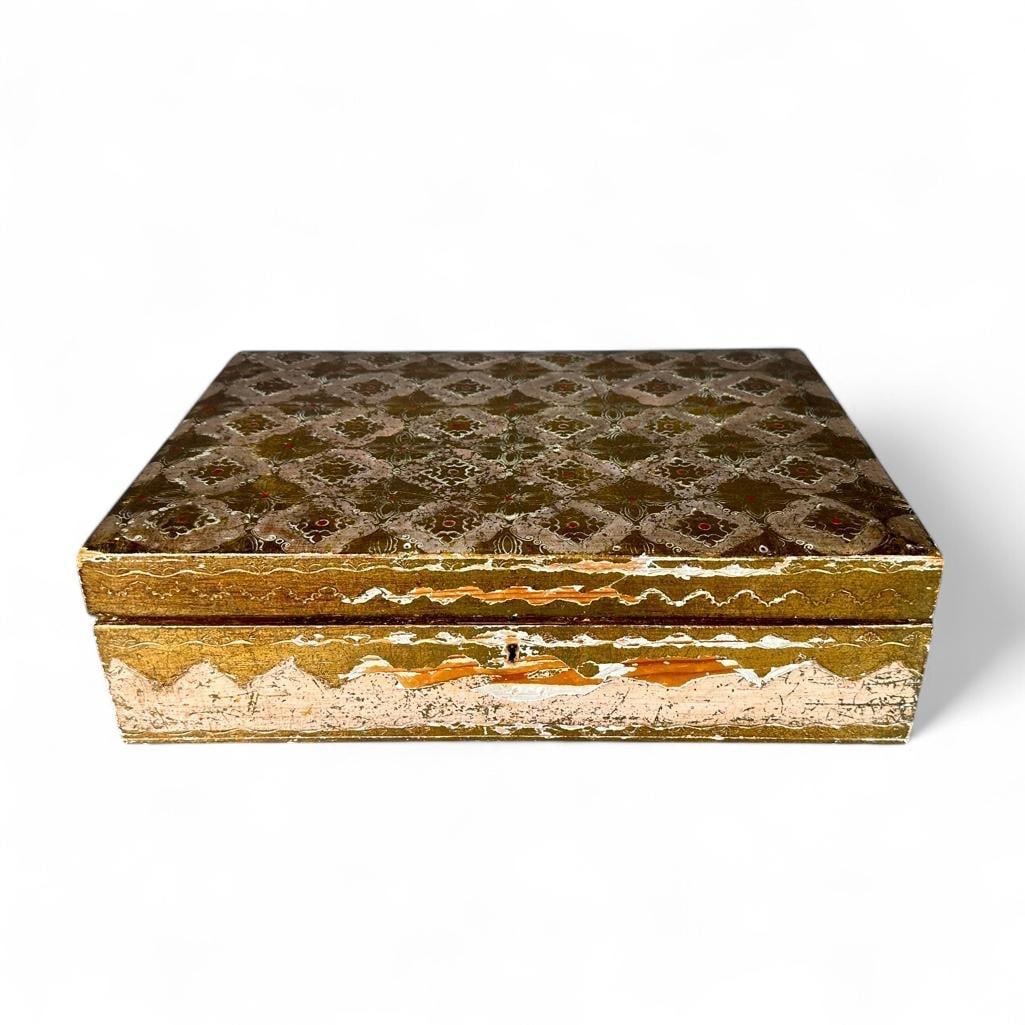 Florentine Jewellry Box: Jewellry box made from pine; gessoed and gilt with red accents, scraffito decoration in Italian style. Hinged top, opens to a red velvet interior with sections to hold rings, etc. Upper trap lifts out
