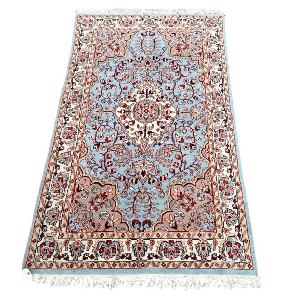 Light Blue HGeriz Carpt 6'6" x 3'10": Wool on cotton weft, knotted fringe ends. Light blue ground with white Arabesque medallion, mauve/gray corner guards, white border flanked by light tan edging with vine scroll. Dimensions: Approx. 6&#