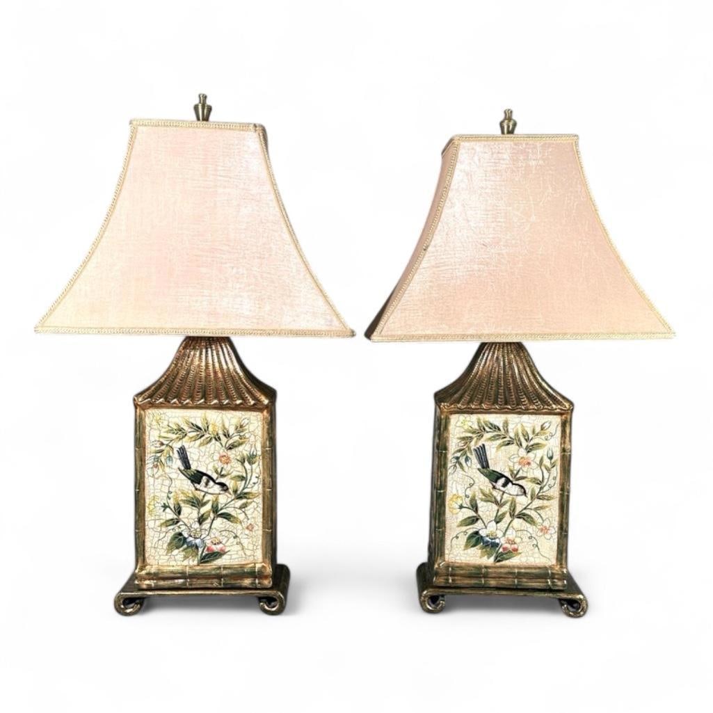 Pair of Pagoda Shaped Lamps With Birds: Polychrome lantern shaped lamps with pagoda style top, decorated with birds, with flared shades and finials, on scroll bases. Dimensions: 28.5" tall x 9.25" wide x 5" deep Condition: very 
