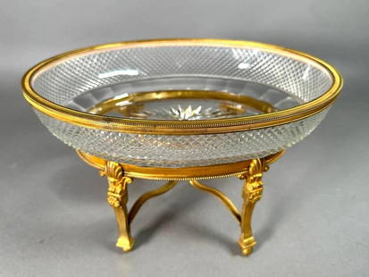 Empire Style Bronze Mounted Crystal Centerpiece, Early 20thc.: Empire Style Bronze Mounted Crystal Centerpiece, Early 20thc. The oval bowl cut with a diamond pattern with star to the base interior, resting inside a gilt bronze stand cast with anthemion, on