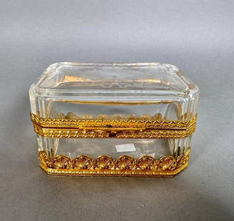French Engraved Crystal Box with Ormolu Mounts: French Engraved Crystal Box with Ormolu Mounts, early 20thc. Rectangular form with canted corners in clear crystal, engraved to the top with floral sprigs and ribbon bows, fitted with ormolu mounts, t