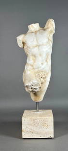 Carved White Marble Torso of a Nude Male, After the Greek or Roman: Carved White Marble Torso of a Nude Male, after the antique, in an active pose, mounted on metal standard and squared travertine base. Dimensions: 20.5 in. total h. Marble only 15 in.h. Condition: Ver