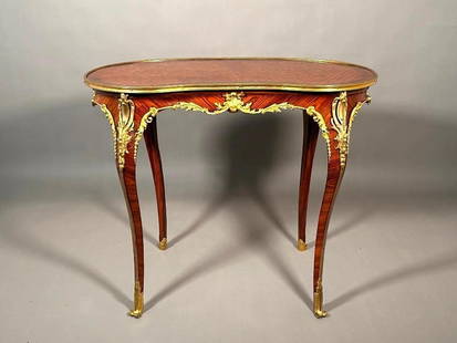 Louis XV Style Parquetry Kidney Shaped Table, 19thc.: Louis XV Style Parquetry Kidney Shaped Table, 19thc. the shaped top inlaid with a geometric pattern of overlapping geometric cubes in a Kingwood banded border, the shaped frieze fitted with gilt bronz