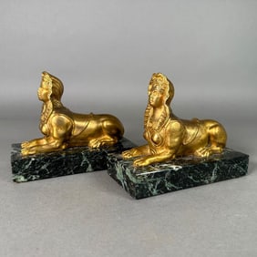 Two Bronze Sphinx Ornaments