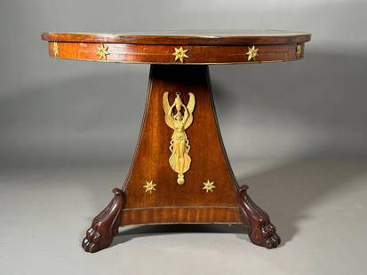 Empire Mahogany Bronze Mounted Gueridon, 19thc.: Empire Mahogany Bronze Mounted Gueridon, 19thc. The circular top in mahogany, the plain frieze fitted with gilt bronze stars, on a pyramidal pedestal base mounted with winged female figures supporting