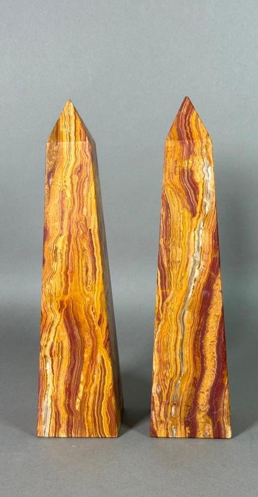 Pair of Natural Onyx Obelisks: Pair of Natural Onyx Obelisks, Pakistani onyx in striated red and brown with white veining. Dimensions: 12.5 in.h. Condition: Very good.