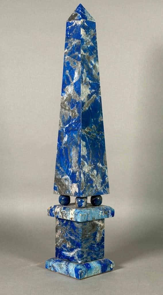 Lapis Lazuli Obelisk, 20thc.: Lapis Lazuli Obelisk, 20thc. Squared tapering veneered form resting on four spherical feet and squared columnar base. Dimensions: 18.5 in.h. Condition: Very good with no damage or restoration.