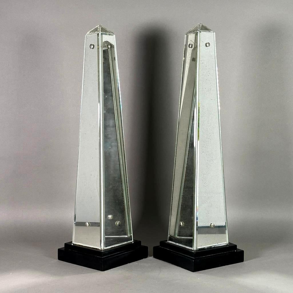 Pair of Mirrored Obelisks, Early-Mid 20thc.: Pair of Mirrored Obelisks, Early-Mid 20thc. On stepped ebonized bases. Dimensions: 22.5 in.h. Condition: Very good vintage condition.