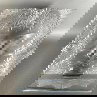 Large Lalique Molded and Frosted Glass "Masque de Femme": Large Lalique Molded and Frosted Glass "Masque de Femme." Squared form in clear frosted glass molded with the face of a woman with four spiny open mouthed fish flanking, in original chromed metal stan