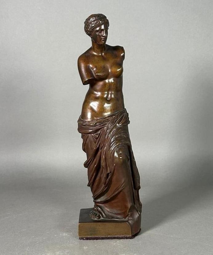 Grand Tour Bronze of the Venus de Milo, late 19thc.: Grand Tour Bronze of the Venus de Milo, late 19thc. Otherwise known as the Aphrodite of Milos, the classical nude, armless, draped below the waist, raised on a squared integral base. Bronze with brown