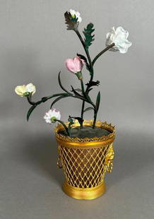 French Gilt Metal, Tole and Porcelain Flower Pot: French Gilt Metal, Tole and Porcelain Flower Pot, lattice flower pot in gilt metal with lion and ring mask handles, fitted with tole peinte stems with porcelain blooms. Dimensions: 11 in.h. Condition: