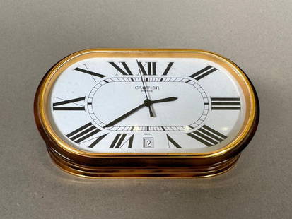 Cartier "Panthere" Accordion Enamel Desk Clock: Cartier "Panthere" Accordion Enamel Desk Clock, in original Cartier red leather box, the oval dial with white face and Roman numerals in black, marked Cartier, Paris, with perpetual date dial at 6 o'c