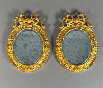 A Pair of French Gilt Bronze Framed Small Mirrors