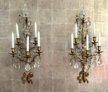 Pair of Gilt Bronze and Crystal Five Light Wall Sconces: Pair of Gilt Bronze and Crystal Five Light Wall Sconces,the backplate cast in the form of a ribbon tied at the bottom with a bow, supporting five arms, each with pendant crystal drops, surmounted by p