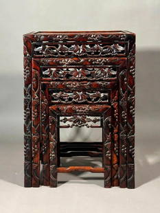 Set of Chinese Rosewood Nesting Tables: Set of Chinese Rosewood Nesting Tables, graduated tables with rectangular tops and pierce carved frieze, raised on squared carved legs joined by stretchers. Dimensions: 28 x 19.5 x 14 in. the largest.