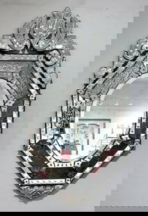 A Venetian Glass Mirror, Modern: A Venetian Glass Mirror, Modern. The octagonal form fitted with engraved glass panels and surmounted by a heart shaped cartouche and stylized foliate scroll. Dimensions: 48 x 29 in. Condition: Very g