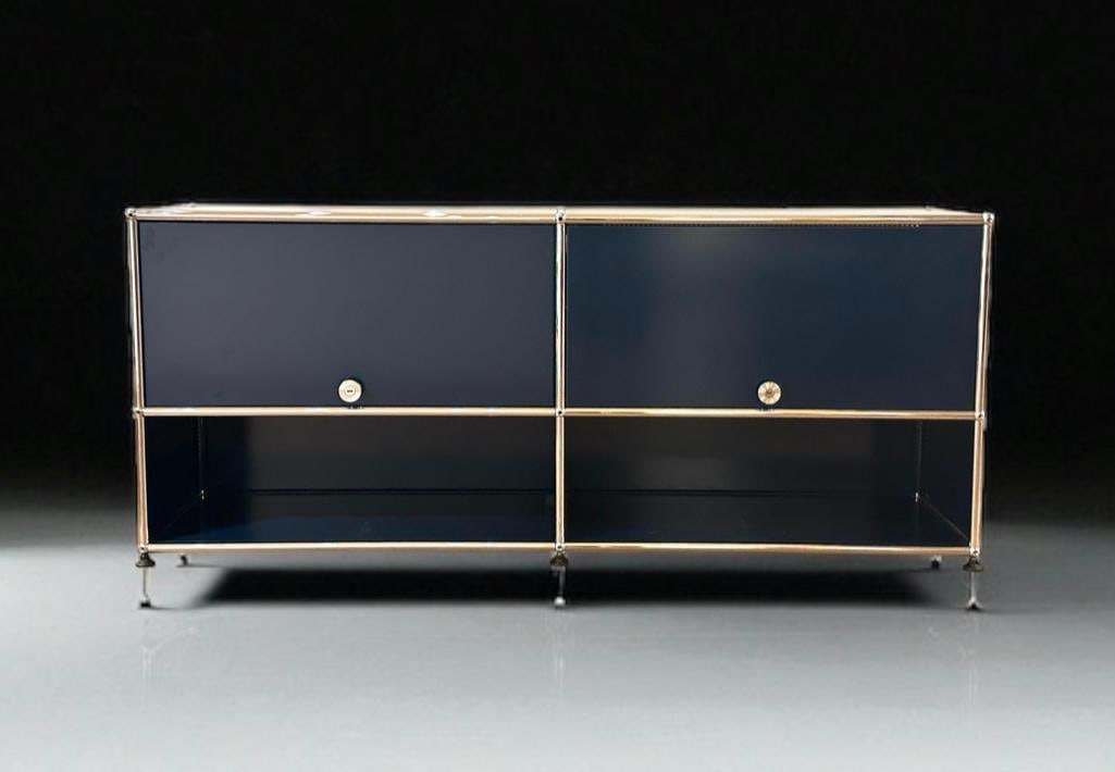 USM Haller Modular Console Cabinet: USM Haller Modular Console Cabinet, in Steel Blue, the rectangular top with chromed steel frame and powder coated steel panels, comprising two hinged lift doors with perforated backs over two open she
