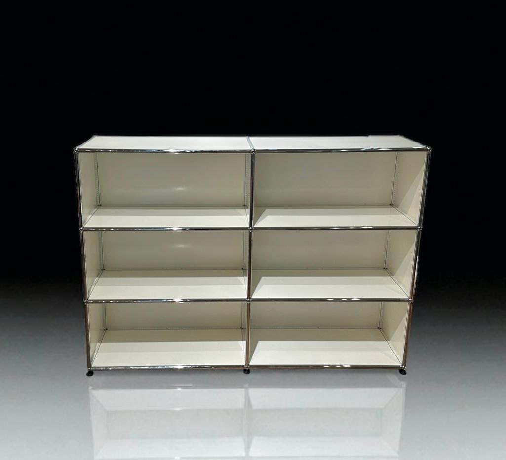 USM Haller Modular Shelving Unit: USM Haller Modular Shelving Unit, in White, rectangular form in chromed steel and powder coated steel, comprising two banks of three open shelves. Bearing clear applied USM Haller label. Dimensions: 4