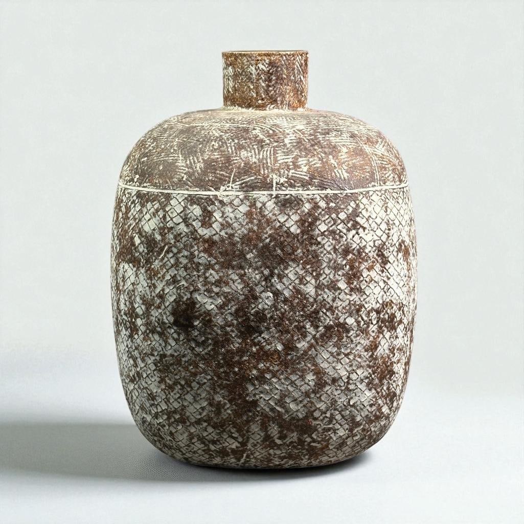 Claude Conover (1907-1994): "Chrapas" stoneware vessel with applied slip over a multi-patterned surface. Signed and titled on bottom, includes the original plastic liner. Dimensions: Apprx 12.5"T Condition: no damage or restorat