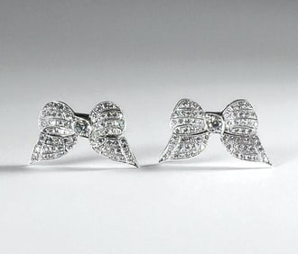 Pair of Antique Platinum and Diamond Bow Pins, c.1930's