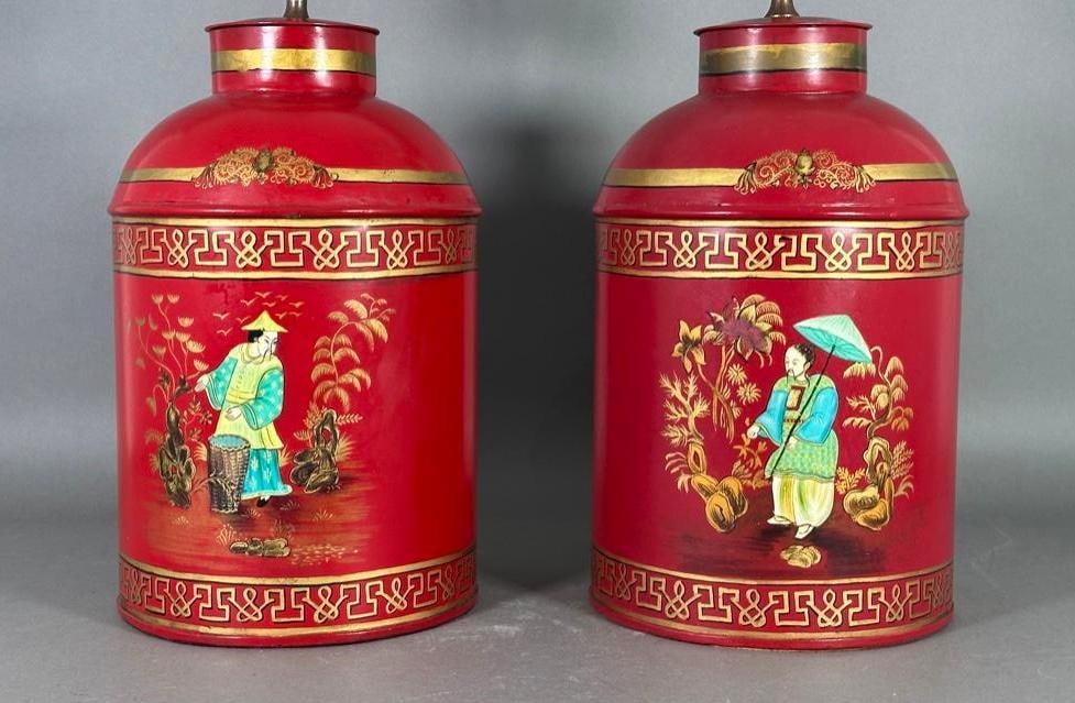 Pair of Chinoiserie Tole Tea Cannister Lamps, Modern: Pair of Chinoiserie Tole Tea Cannister Lamps, Modern. Cylindrical forms with domed tops hand decorated with Chinoiserie figures in stylized landscapes on a red ground, highlighted with gilded decorati