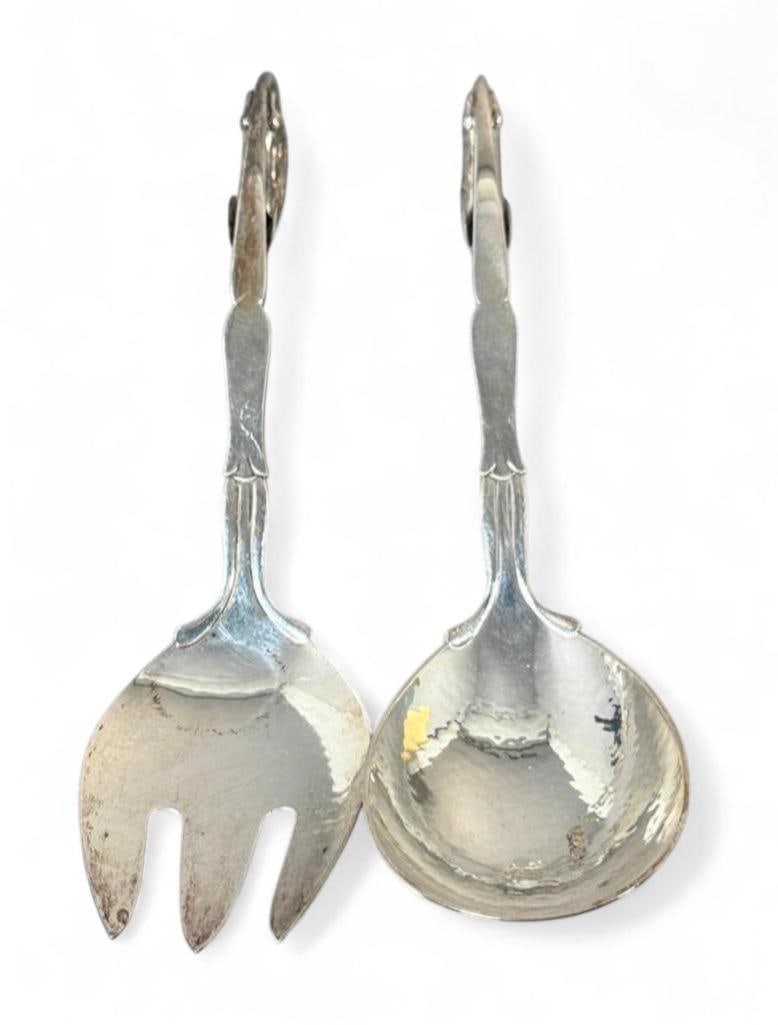 Pair of Georg Jensen Sterling Silver Serving Utensils: Pair of Georg Jensen Sterling Silver Serving Utensils, serving spoon and fork, each with hand hammered bowl and scroll handle with stylized leaf and berry, stamped Georg Jensen and pattern #141. Dimen
