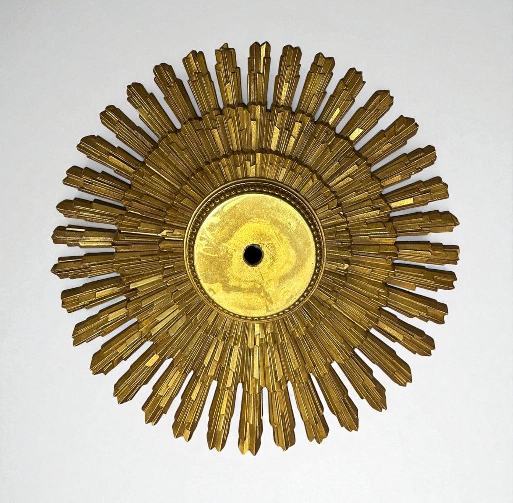 MCM Radiant Ceiling Mount: Made by Syroco, dated 1969, hard molded plastic, polymer in gold as a radiant starburst. For use as a ceiling mount for lighting, or any ornamental use, wired for hanging. Marked on verso copyright MC