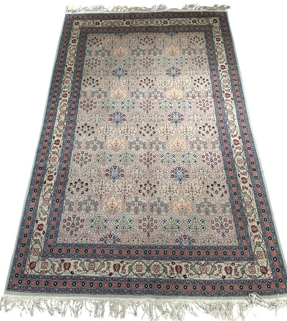 Isfahan Carpet 8'7" x 5'4": Medium to light green-blue ground with floral panel design, rose color edges on a cream border with scrolling blossoms on vines, long knotted fringe ends, with cream and other colors, all wool on cott