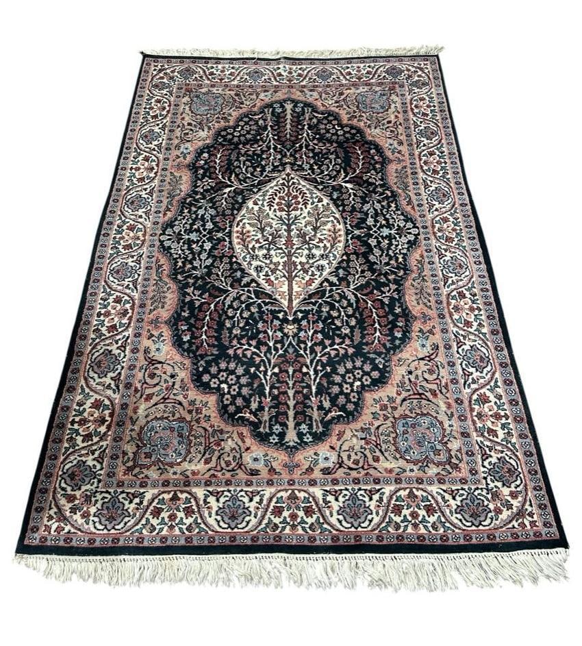 Indo-Persian Kashmiri Carpet 9'6" x 7'6": Medium pile, dense wool on cotton weft, medium fringe ends, Soft, subtle colors in a traditional Tabriz design of central medallion in cream with palmettes within a dark blue scalloped cartouche, tan