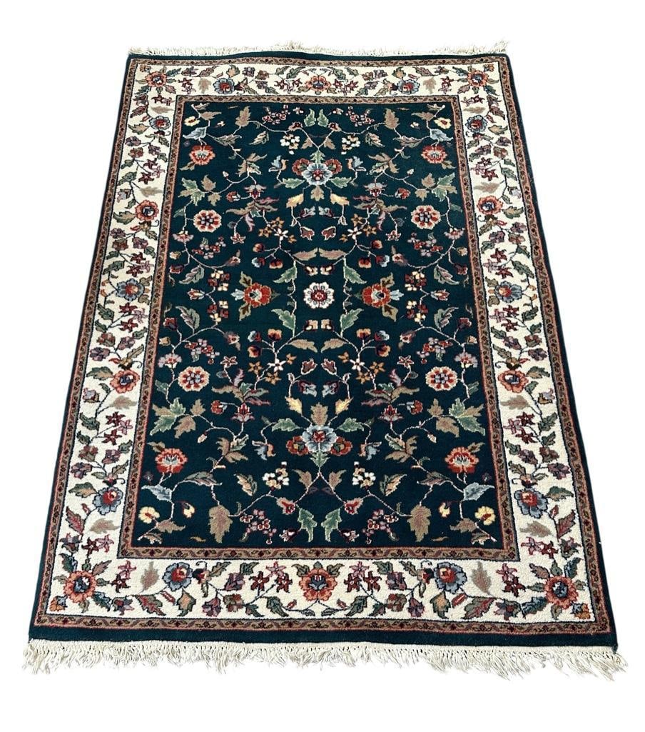 Indo-Persian Tabriz Carpet, 5'9" x 4': Thick, soft wool on cotton weft, with darl blue ground field with colorful flower blossoms on stems and leaves, trimmed in tan edging and bright white border with similar flowers. Measures apprx 5'9"