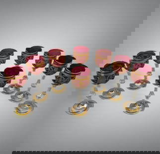 Seven St. Louis "Congress" Pattern Cranberry Colored Glass Wines: Seven St. Louis "Congress" Pattern Cranberry Colored Glass Wines, the bowls in cranberry flashing engraved with a gilded pattern of lion and ring masks supporting fruiting and leaf swags, raised on