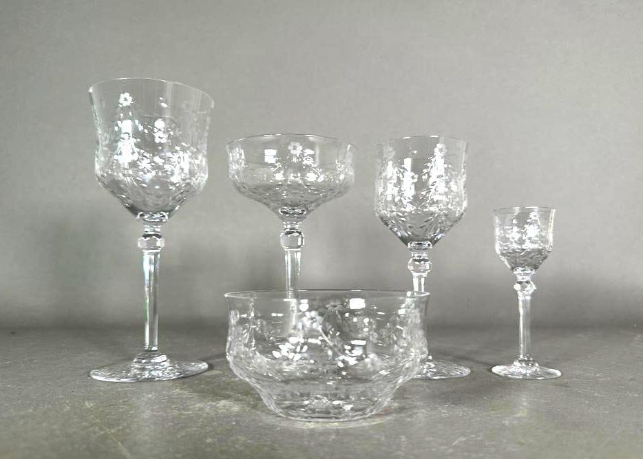 Large Attactive Service of Engraved Crystal Stemware, Early 20thc.: Large Attractive Service of Engraved Crystal Stemware, early 20thc, in clear crystal engraved with leaf swags and florettes on faceted knops and tapered stems, comprising; 9 Water Goblets, 7.5 in.h. 1