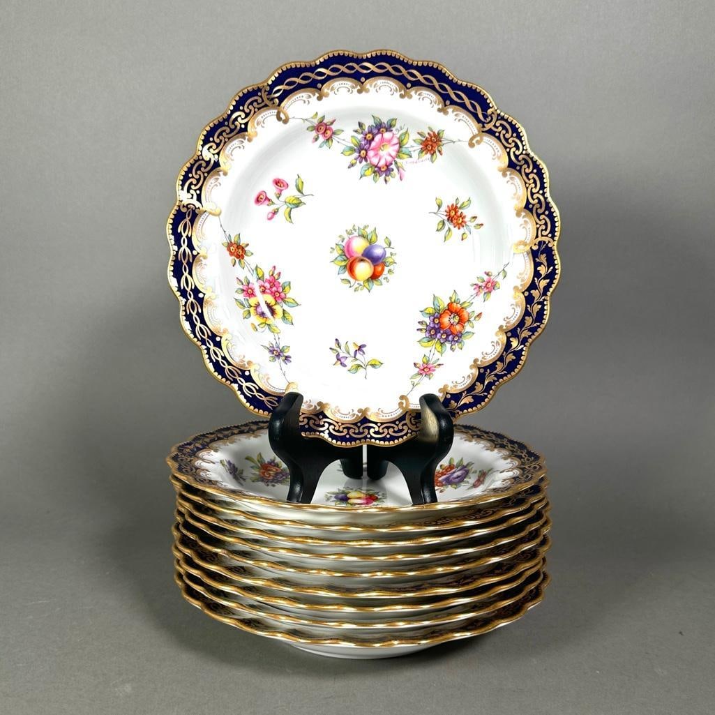 Ten Spode Hand Painted Rim Soup Plates, Retailed by Tiffany & Co.: Ten Spode Hand Painted Rim Soup Plates, Retailed by Tiffany & Co. Scalloped rims decorated in cobalt blue with gilded vine and scroll patterns, hand painted with floral swags centering fruits, each pl