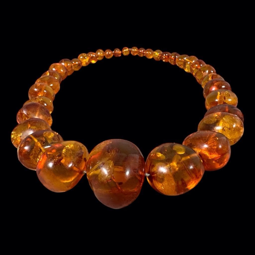 Amber Bead Necklace: Amber Bead Necklace, graduated ovoid amber beads, without clasp. Dimensions: 13/26 in.l. Condition: Very good.