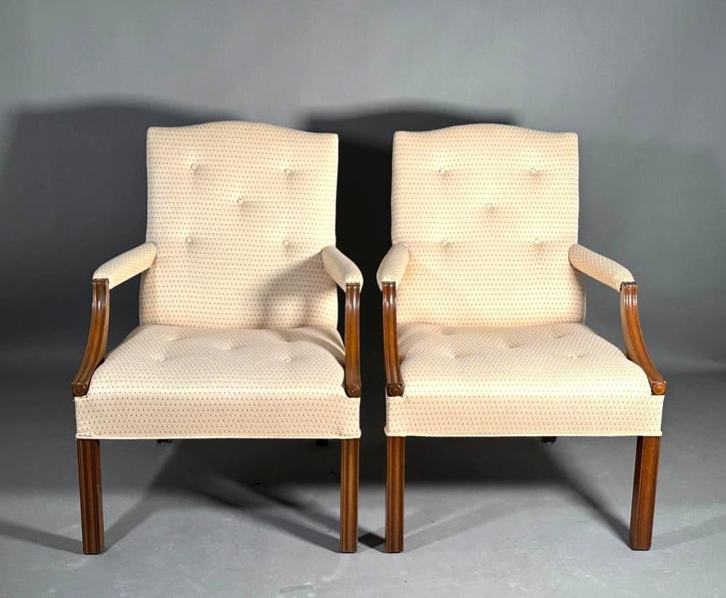 A Pair of Georgian Style Lolling Chairs: Pair of Georgian Style Lolling Chairs, modern. With down-swept arms and upholstered backs and seats. Dimensions: 36 x 25 x 24 in. Condition: Very good. Very sturdy.