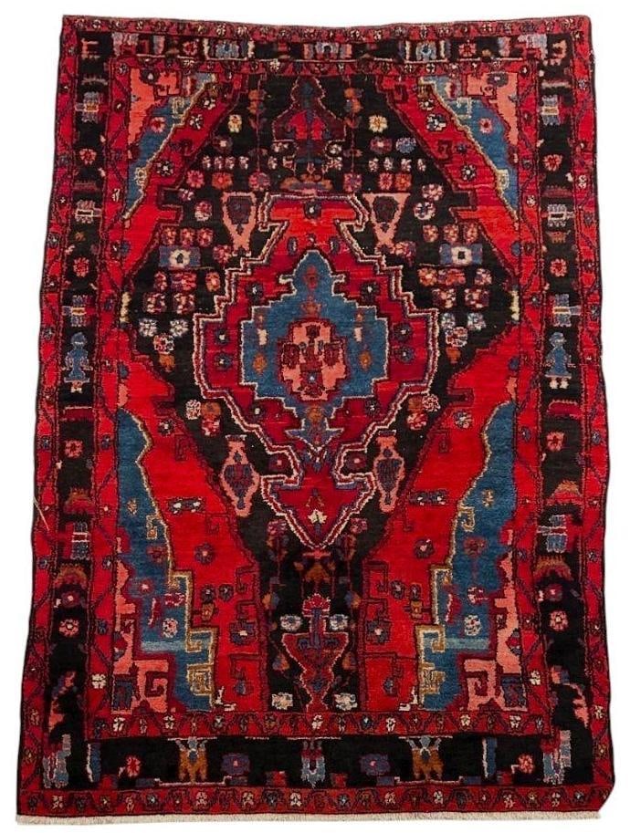 Persian Carpet 7'4" x 5'1": Persian Carpet 7'4" x 5'1", in red and blue/black, wool on cotton, with figures and geometric flowers. Short knotted fringe ends. Condition: general wear from use. Recommending