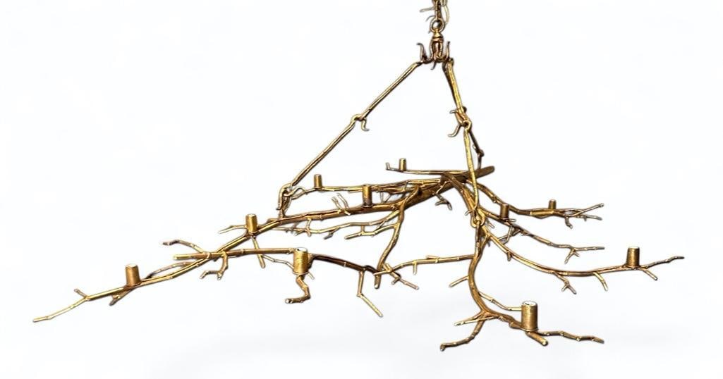 Paul Ferrante Gilt Metal Branch Chandelier: Paul Ferrante Gilt Metal Branch Chandelier, 10 light branch form light fixture with hook and bar pendant support. Dimensions: Approximately 72 x 26 x 46 in. Condition: Very good with no damage or