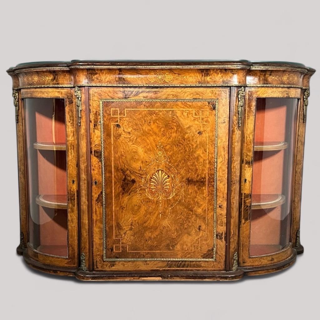 English Victorian Burl Wood and Marquetry Console Cabinet: English Victorian Burl Wood and Marquetry Console Cabinet, mid-late 19thc. The shaped top in burl wood, line inlaid, over an anthemion inlaid frieze, above a center hinged door inlaid to the center