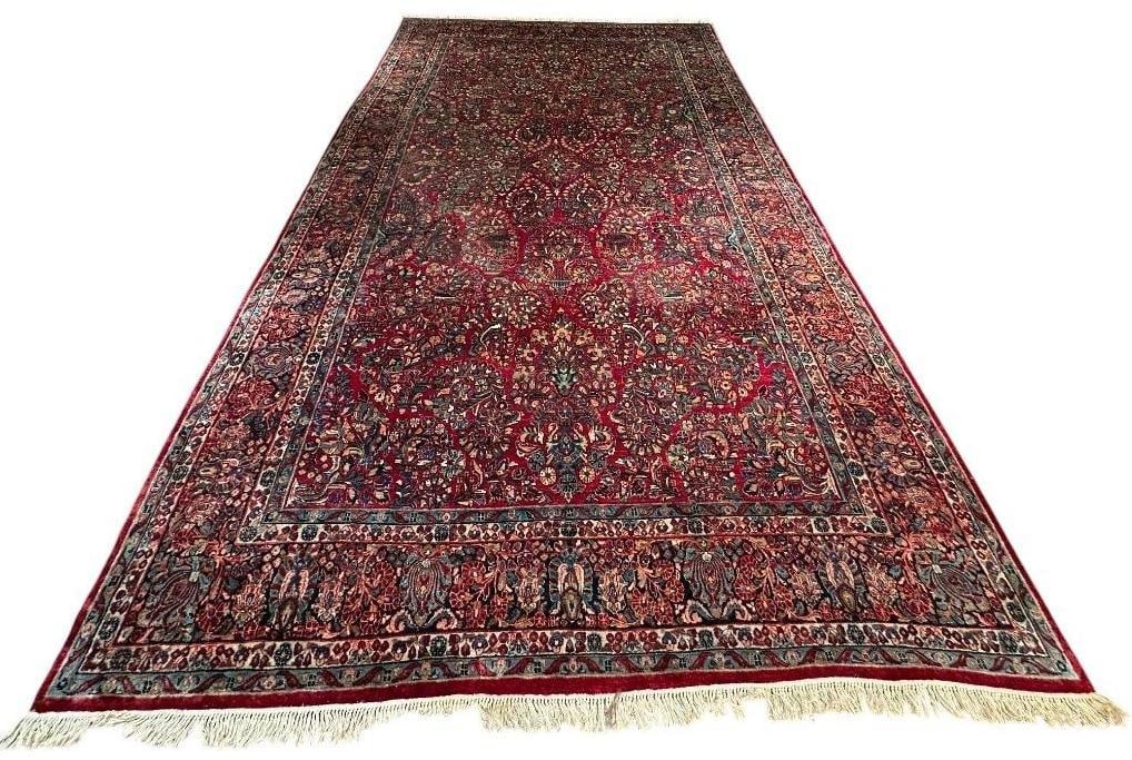 Large Sarouk Carpet 17'9" x 10': Beautiful red Sarouk, purchased from the House of Davidian, soft thick wool on cream and light blue color cotton weft. Overall scattered flowers, wide border with cream and light blue edge borders,