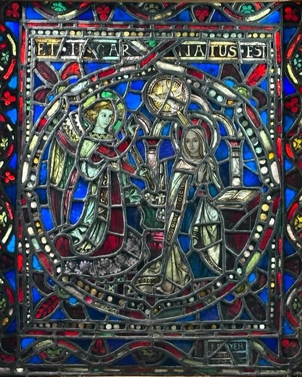 Franz Mayer Studio Leaded and Stained Glass Panel: Annunciation to the Virgin, in colored glass, with reverse painting, Munich style. Mary and the angel and holy spirit within a circle, Latin inscription "Et Incarnatus Est," above, signed " F. MayerMu