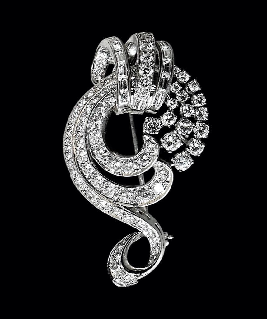 Vintage Platinum and Diamond Brooch: Vintage platinum and diamond brooch or pin, weighing 19 grams total, set with 67 round channel set diamonds, 15 prong set, 12 square cut diamonds also channel set; apprx 4 carats TDW. Bar pin on verso